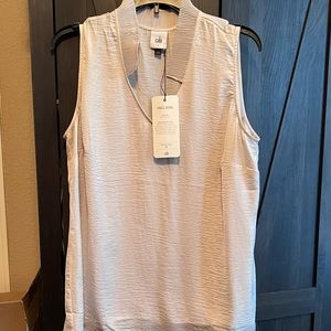 Cabi brand Snapshot Top. New. Never worn. Does not stretch.Size Large.